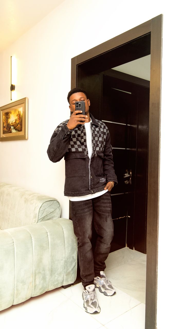 Man taking a mirror photo in a modern living room