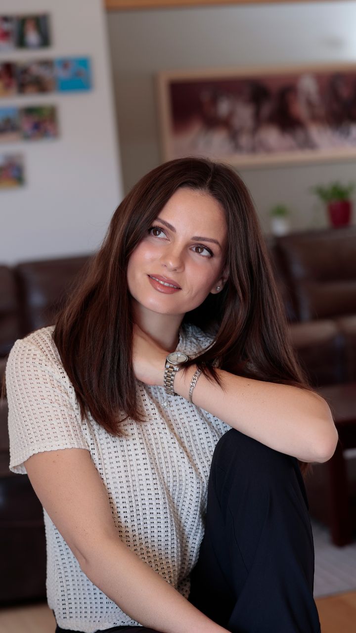 Young woman relaxing indoors in natural light